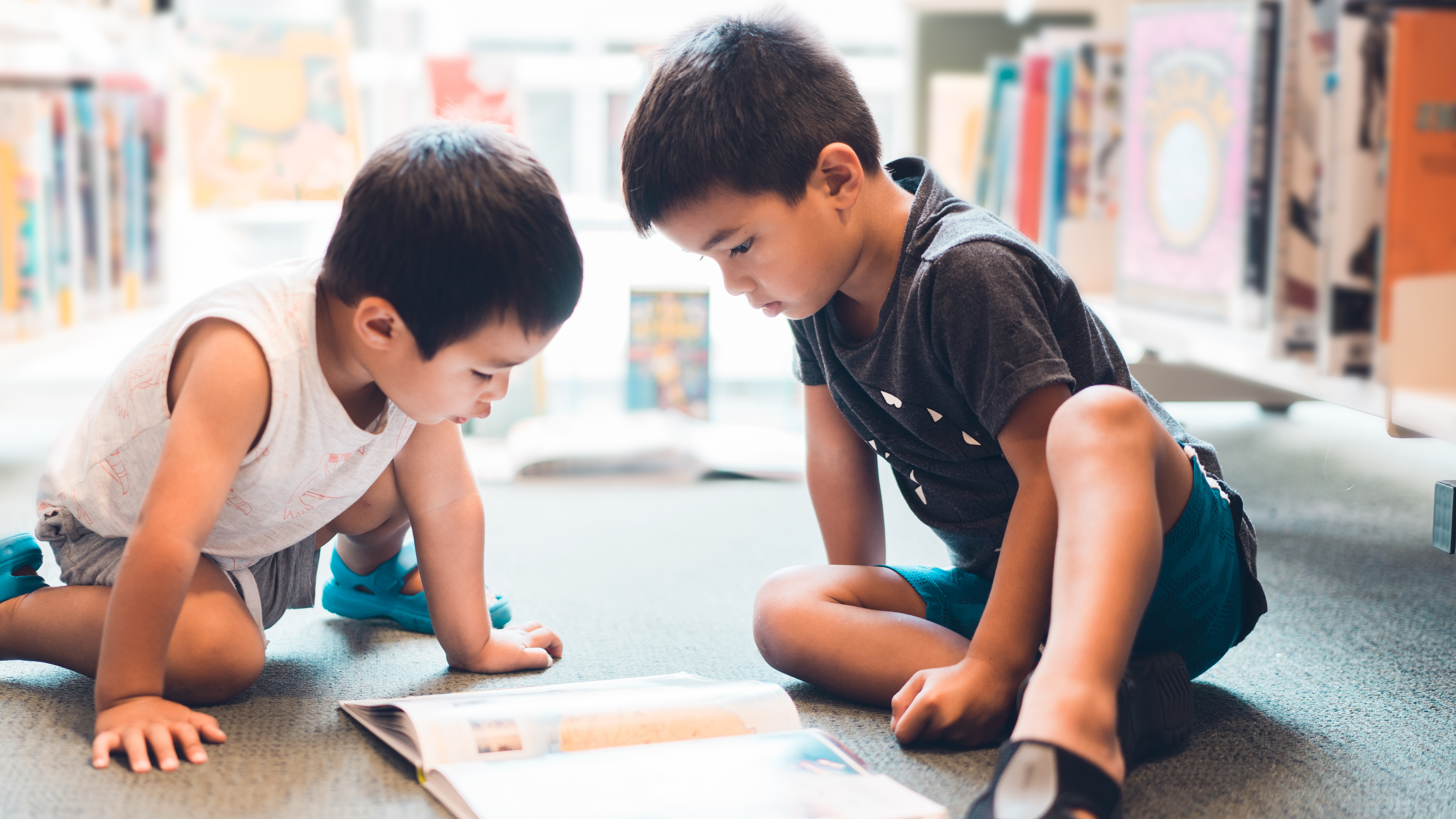 Boys Reading Book Stock Image